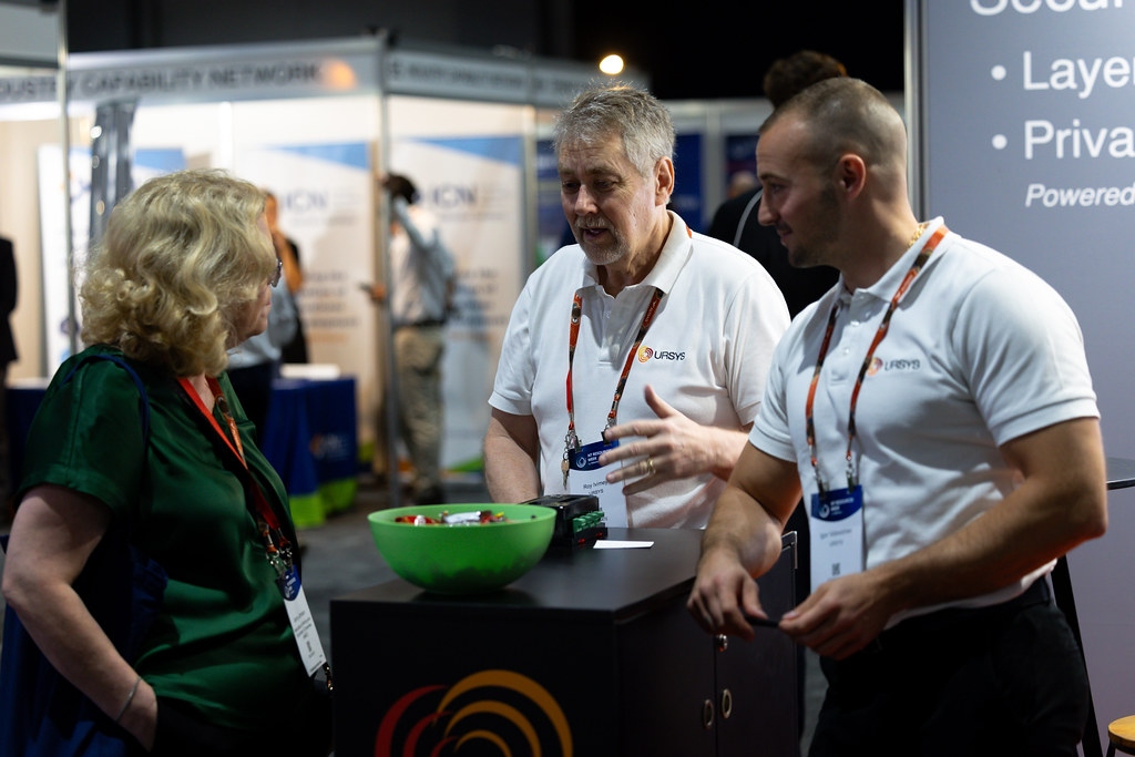 at booth discussing